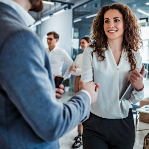 Business people having fun and chatting at workplace office